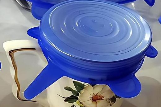 Small blue silicone lid stretched over a ceramic mug
