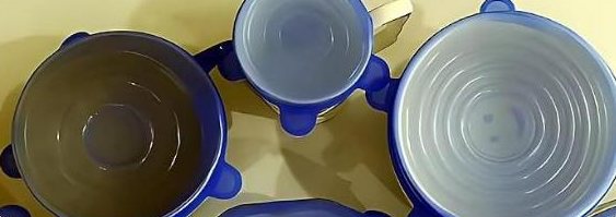 Lids next to bowls and a mug of different sizes